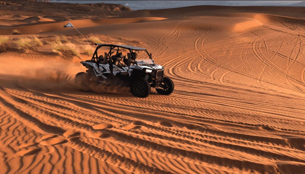 A side-by-side riding the dunes in Southern Utah. Activities to do at Sand Hollow Resort.