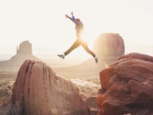 Man Jumping Between Rocks
