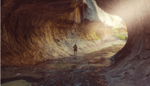 man hiking in canyon