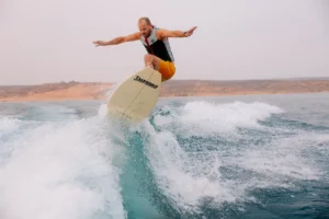 Wake surfer gliding across the water at Sand Hollow Reservoir.
