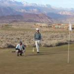 Golfers competing in a tournament on a scenic course.