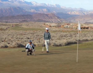 Golfers competing in a tournament on a scenic course.